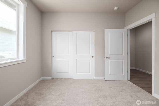 776 Parkland Loop, Sedro Woolley, WA 98284 - unfurnished bedroom with carpet, a closet, and baseboards