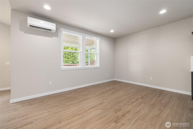 776 Parkland Loop, Sedro Woolley, WA 98284 - empty room featuring a wall mounted AC, light wood-style floors, baseboards, and recessed lighting