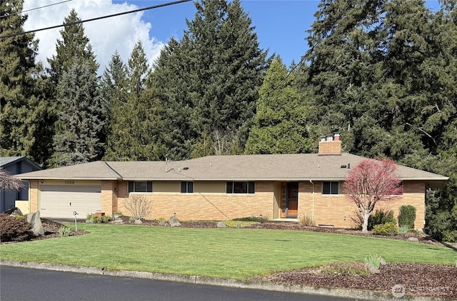 ranch-style house with a garage, brick siding, a chimney, and a front lawn