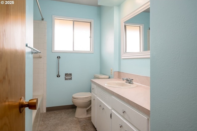 full bath with vanity, toilet, and baseboards