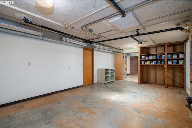 garage featuring baseboards