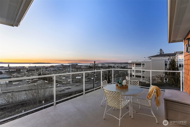 view of balcony at dusk