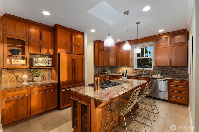 kitchen with stainless steel appliances, light stone countertops, a breakfast bar area, and light tile patterned flooring