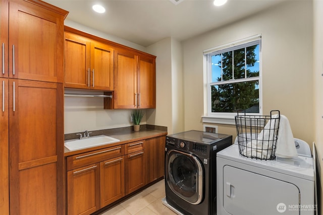 laundry area featuring a sink, recessed lighting, light tile patterned flooring, cabinet space, and separate washer and dryer