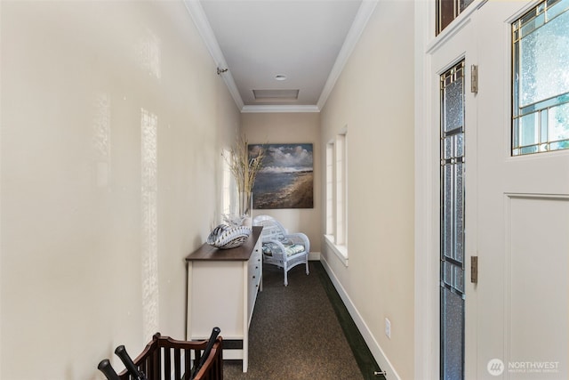 corridor with crown molding, baseboards, and dark colored carpet