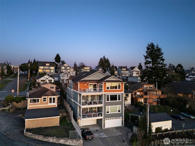 view of front facade featuring a residential view and driveway