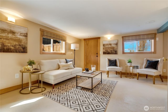 living room with a healthy amount of sunlight and baseboards