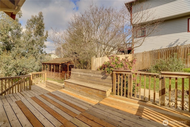 wooden deck featuring fence