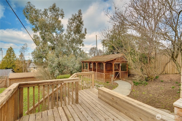 wooden deck featuring an outdoor structure