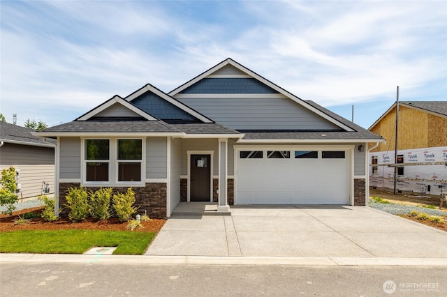 804 Parkland Loop, Sedro Woolley, WA 98284 - craftsman inspired home featuring a garage, driveway, stone siding, and roof with shingles