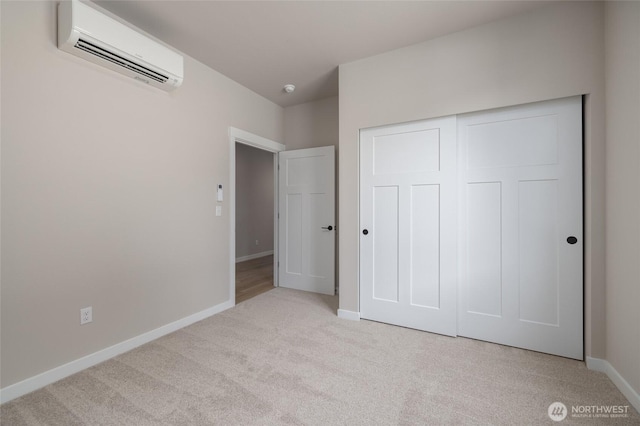 804 Parkland Loop, Sedro Woolley, WA 98284 - unfurnished bedroom featuring a wall unit AC, carpet, baseboards, and a closet