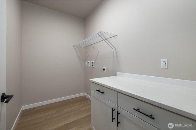 804 Parkland Loop, Sedro Woolley, WA 98284 - washroom featuring washer hookup, light wood-style floors, baseboards, and electric dryer hookup
