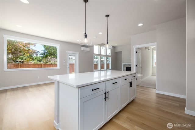 804 Parkland Loop, Sedro Woolley, WA 98284 - kitchen featuring plenty of natural light, light wood finished floors, a kitchen island, light countertops, and recessed lighting