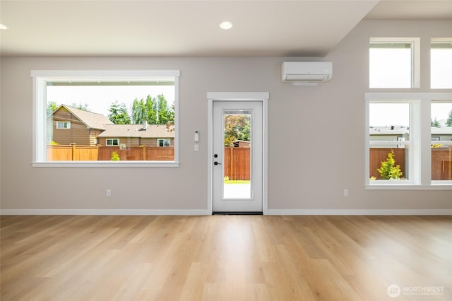 804 Parkland Loop, Sedro Woolley, WA 98284 - foyer featuring a wall unit AC, wood finished floors, healthy amount of natural light, and recessed lighting