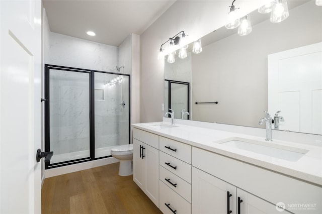 804 Parkland Loop, Sedro Woolley, WA 98284 - bathroom featuring toilet, a marble finish shower, wood finished floors, and double vanity