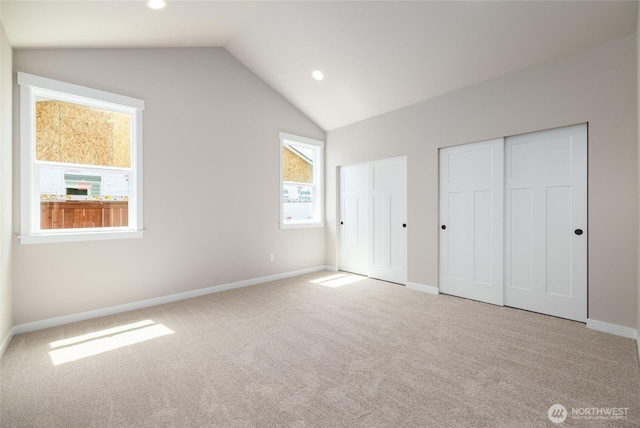 804 Parkland Loop, Sedro Woolley, WA 98284 - unfurnished bedroom featuring lofted ceiling, carpet floors, multiple closets, baseboards, and recessed lighting