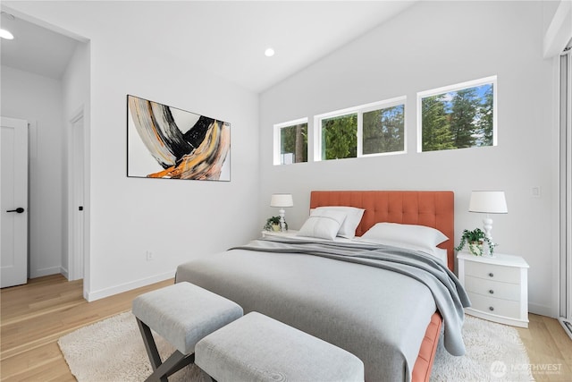 bedroom with light wood-type flooring, baseboards, and recessed lighting