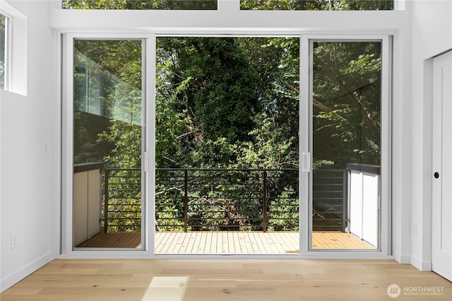 doorway to outside with wood finished floors