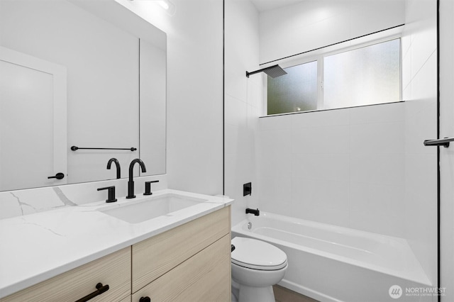 bathroom featuring shower / washtub combination, vanity, and toilet