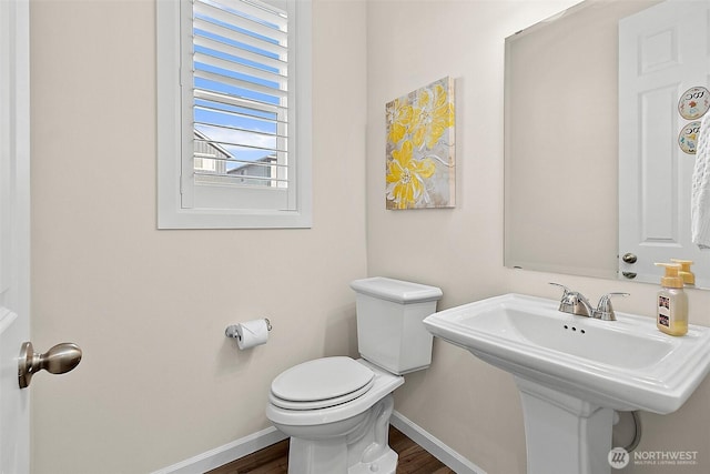 15132 Tyee Dr E, Bonney Lake, WA 98391 - bathroom featuring toilet, wood finished floors, baseboards, and a sink