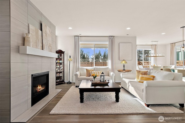 15132 Tyee Dr E, Bonney Lake, WA 98391 - living area with recessed lighting, dark wood-style flooring, and a fireplace