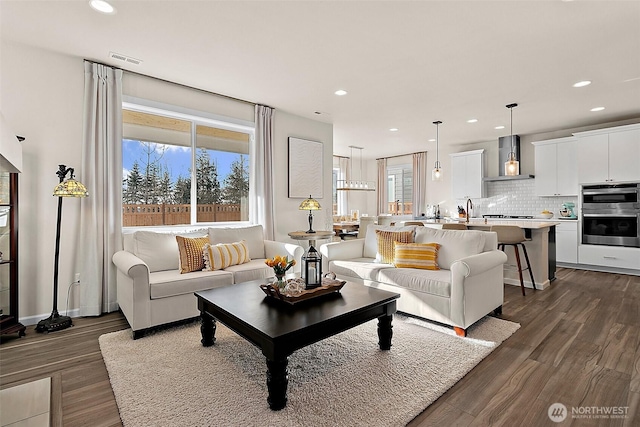 15132 Tyee Dr E, Bonney Lake, WA 98391 - living room featuring dark wood-style floors, visible vents, and recessed lighting