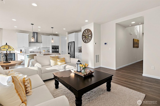 15132 Tyee Dr E, Bonney Lake, WA 98391 - living room featuring visible vents, recessed lighting, baseboards, and wood finished floors