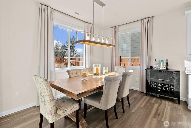 15132 Tyee Dr E, Bonney Lake, WA 98391 - dining space featuring visible vents, baseboards, and wood finished floors