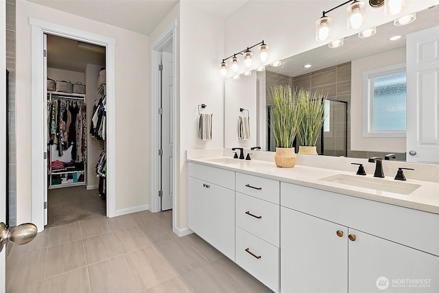 15132 Tyee Dr E, Bonney Lake, WA 98391 - bathroom featuring a sink, double vanity, a stall shower, and a spacious closet
