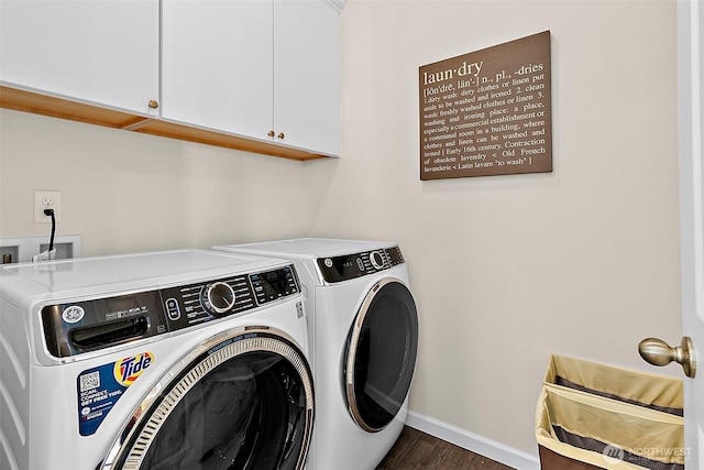 15132 Tyee Dr E, Bonney Lake, WA 98391 - clothes washing area with baseboards, cabinet space, dark wood-type flooring, and washing machine and clothes dryer