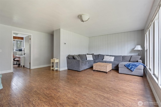 living area featuring wood finished floors and baseboards