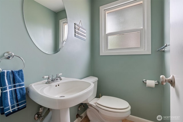 bathroom with toilet and a sink