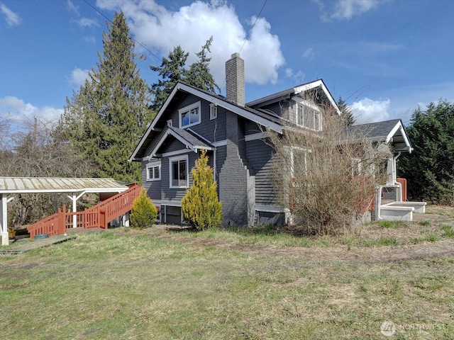 exterior space featuring a lawn and a chimney