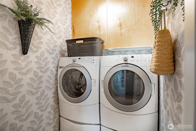 clothes washing area featuring washer and dryer