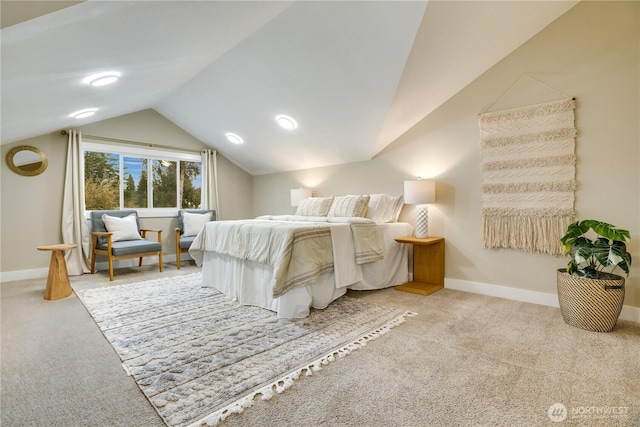 carpeted bedroom with baseboards and vaulted ceiling