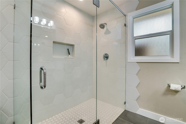 full bath featuring a tile shower