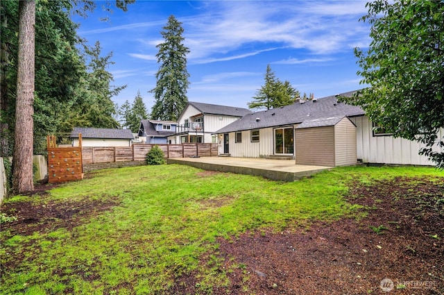 view of yard with a patio area and a fenced backyard