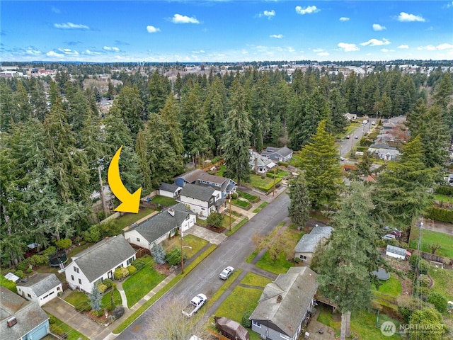 bird's eye view with a forest view and a residential view