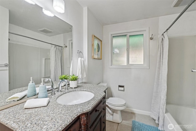 bathroom with vanity, baseboards, visible vents, tile patterned floors, and toilet