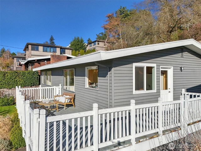 back of house featuring a deck