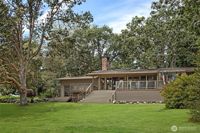 64 Garry Oak Ln, Friday Harbor, WA 98250 - back of property with stairway, a yard, a sunroom, and a chimney