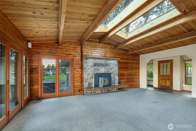 64 Garry Oak Ln, Friday Harbor, WA 98250 - unfurnished living room with lofted ceiling with skylight, wooden walls, carpet flooring, and wood ceiling