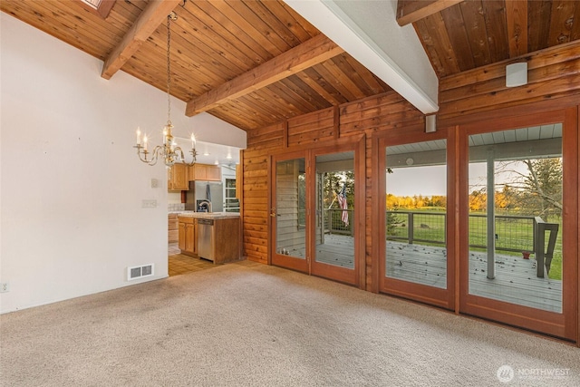 64 Garry Oak Ln, Friday Harbor, WA 98250 - interior space featuring an inviting chandelier, vaulted ceiling with beams, wood ceiling, and visible vents