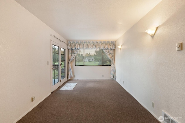 64 Garry Oak Ln, Friday Harbor, WA 98250 - carpeted spare room featuring visible vents and baseboards
