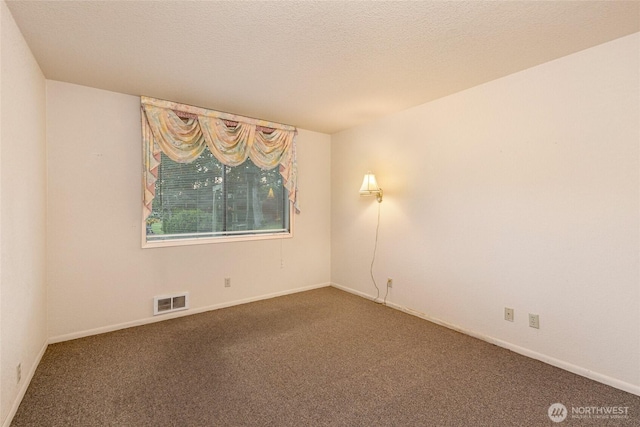 64 Garry Oak Ln, Friday Harbor, WA 98250 - carpeted spare room featuring visible vents, a textured ceiling, and baseboards