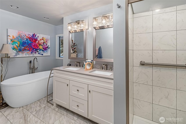 64 Garry Oak Ln, Friday Harbor, WA 98250 - bathroom featuring a soaking tub, double vanity, marble finish floor, and a sink