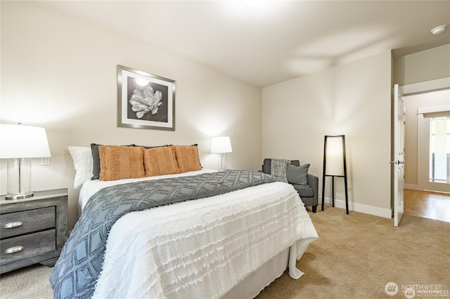 carpeted bedroom with baseboards