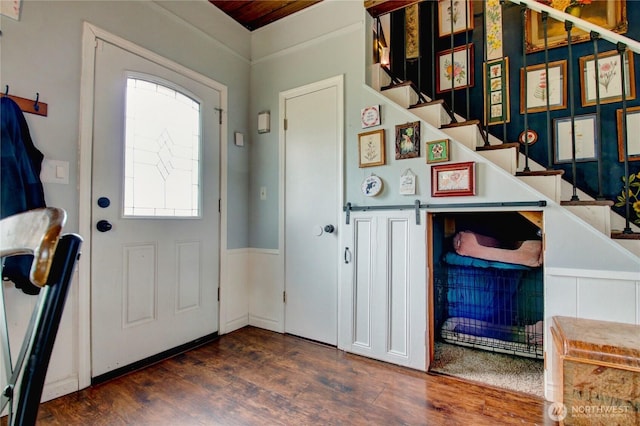 entrance foyer with stairway and wood finished floors