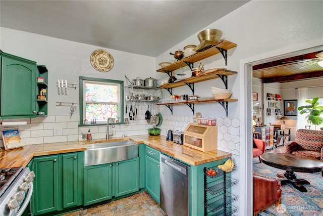 kitchen featuring open shelves, a sink, appliances with stainless steel finishes, wood counters, and backsplash