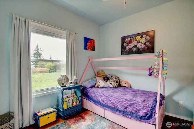 bedroom with wood finished floors